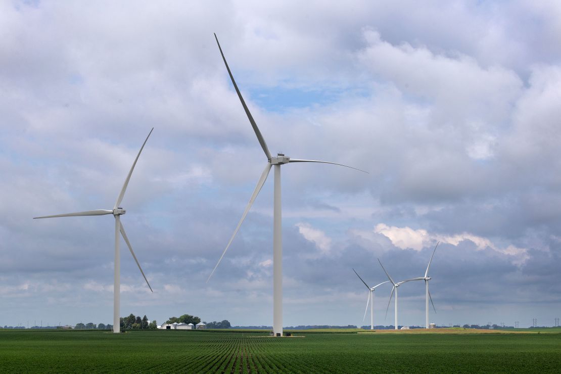 Wind turbines tower over the rural landscape in Pomeroy, Iowa, on July 5. Wind and solar have enjoyed decades of bipartisan support for their tax credits, including from Iowa Sen. Chuck Grassley.