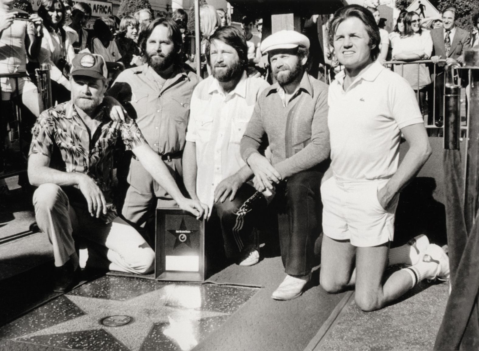 The Beach Boys receive a star on the Hollywood Walk of Fame in 1980. From left are Love, Carl Wilson, Brian Wilson, Jardine and Johnston.