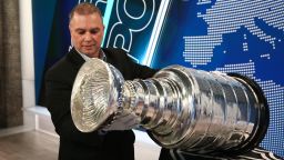 Howie Borrow handles the Stanley Cup while visiting CNN in studio.