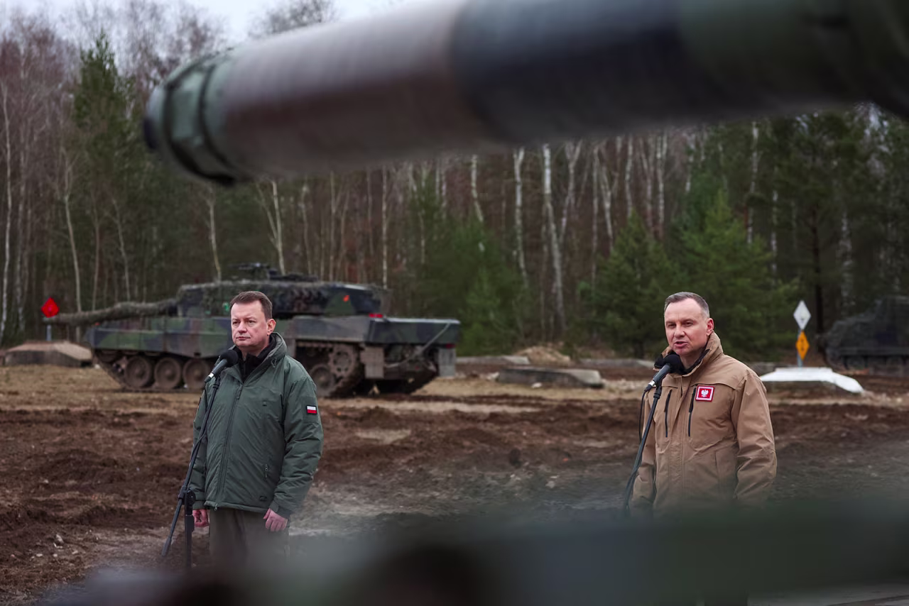Polish President Andrzej Duda addresses the 10th Armoured Cavalry Brigade with Blaszczak on Monday. 