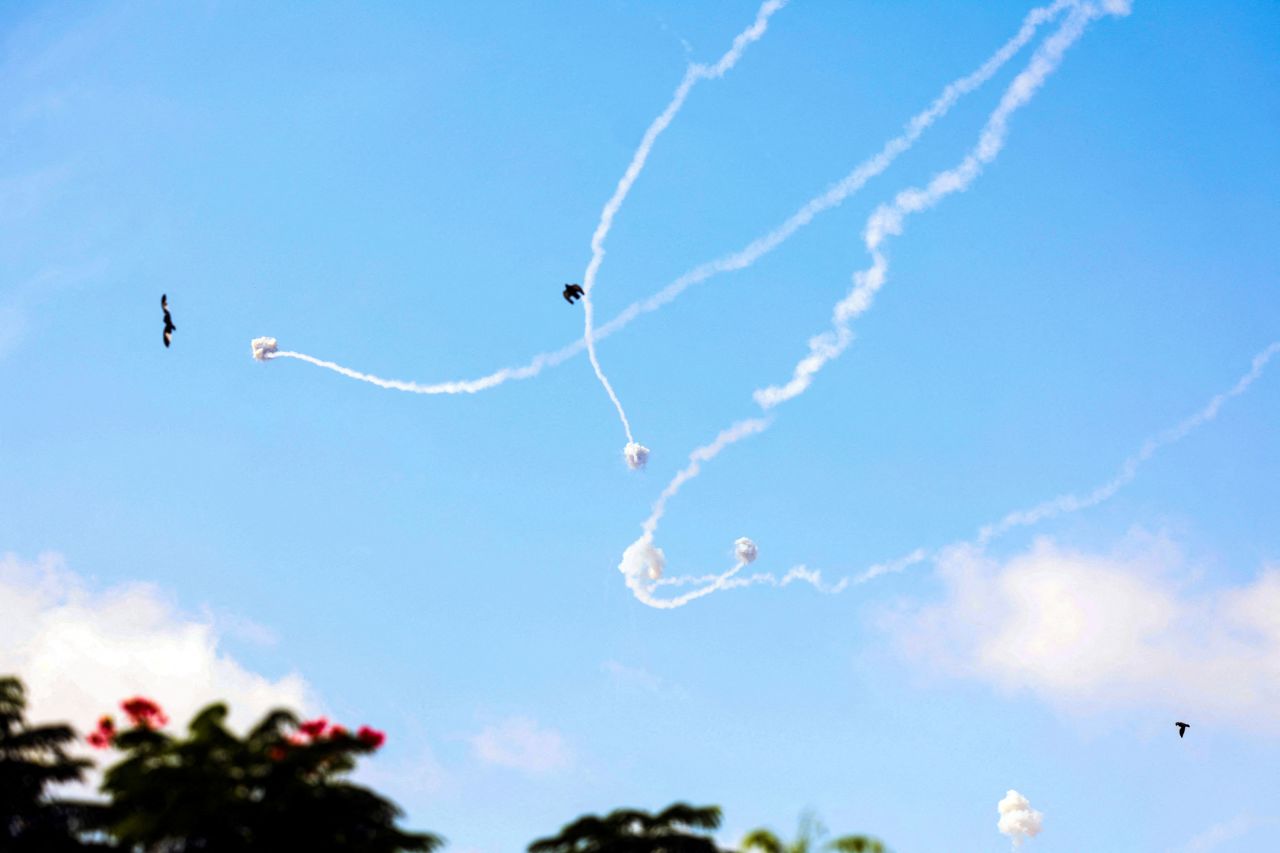 Israel's Iron Dome anti-missile system intercepts rockets launched from the Gaza Strip, as seen from Sderot, southern Israel, on October 8, 2023.