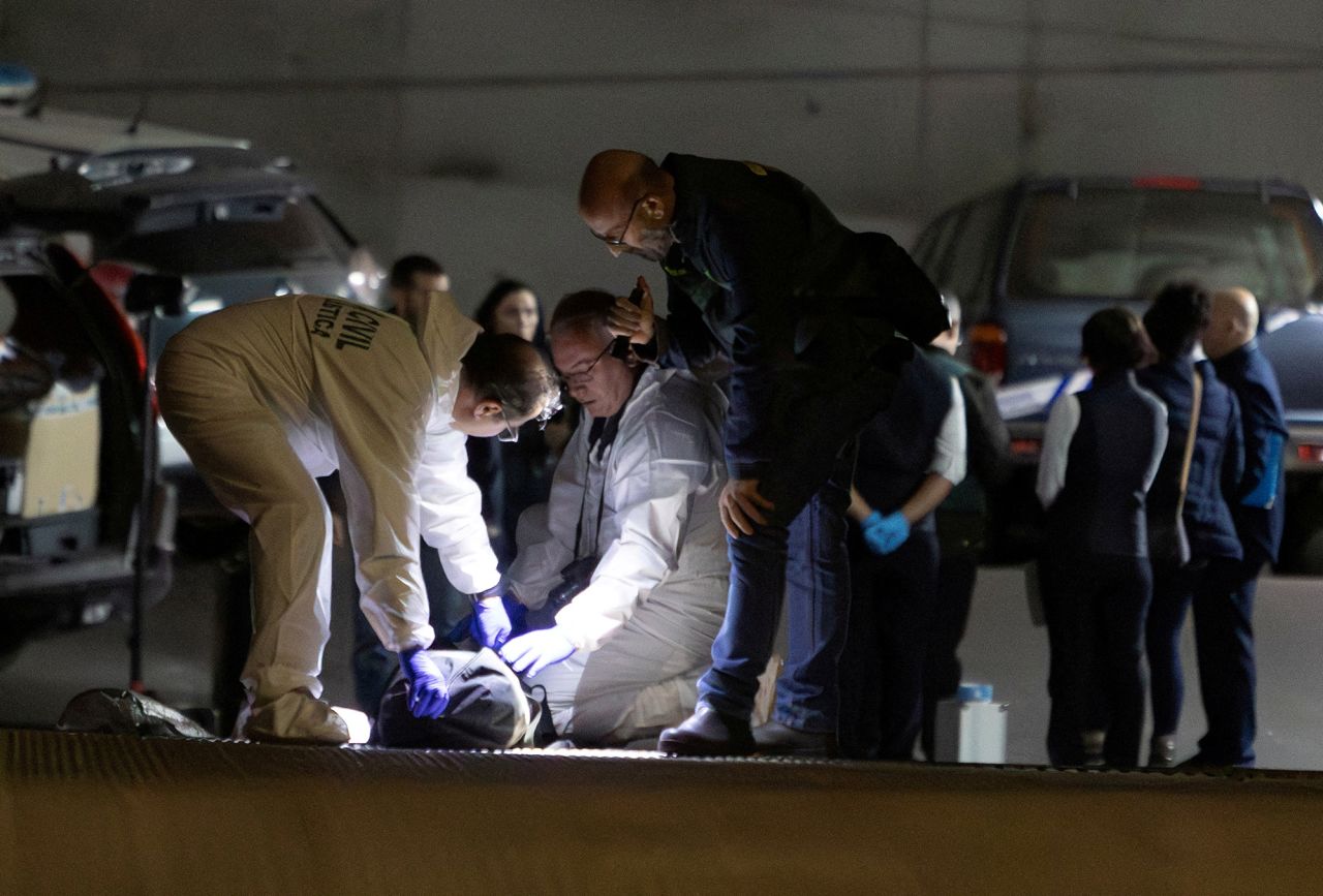 Spanish Civil Guard officers investigate the garage where the body of Russian pilot Maxim?Kuzminov?was found in Villajoyosa, Spain, on February 13.