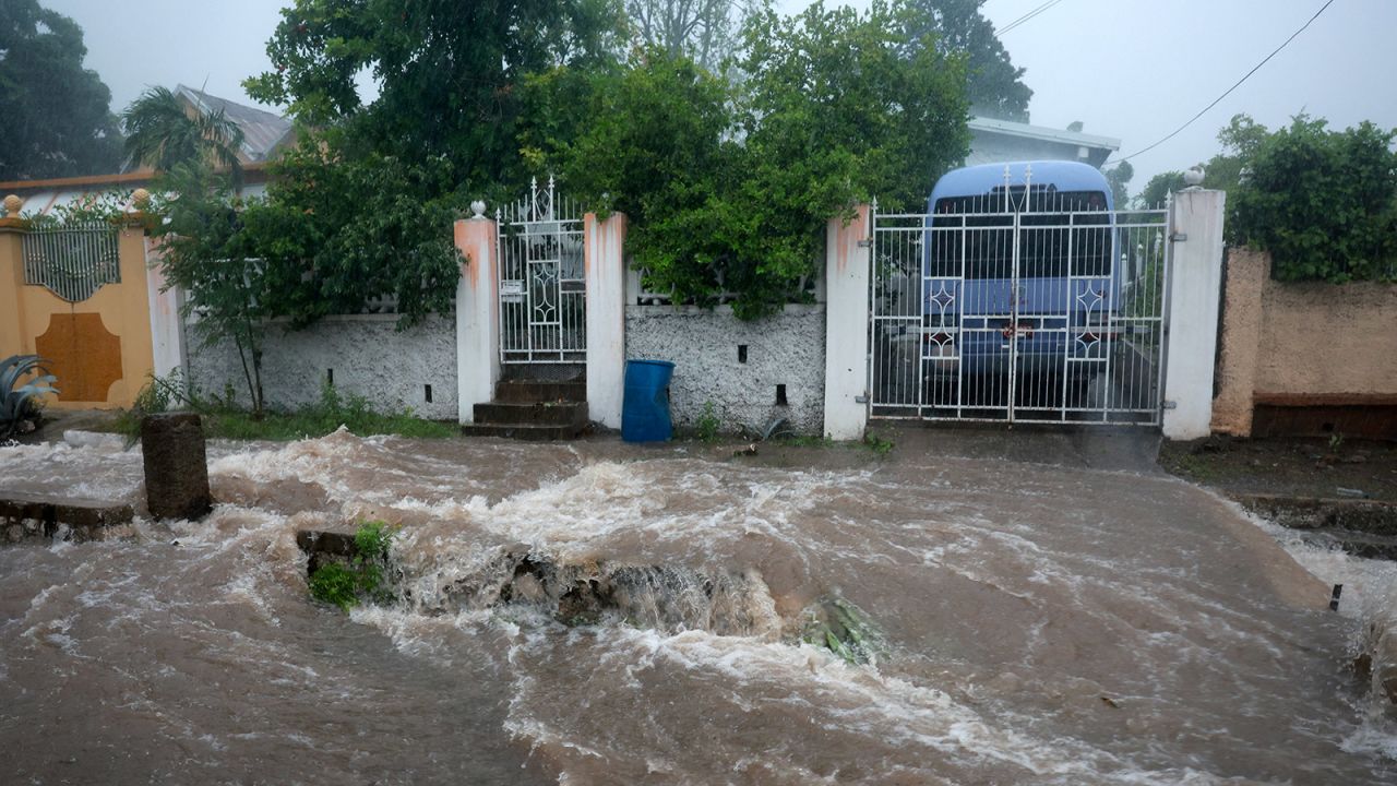 Flood waters pour onto the street as Hurricane Beryl passes through Kingston, Jamaica on July 3.