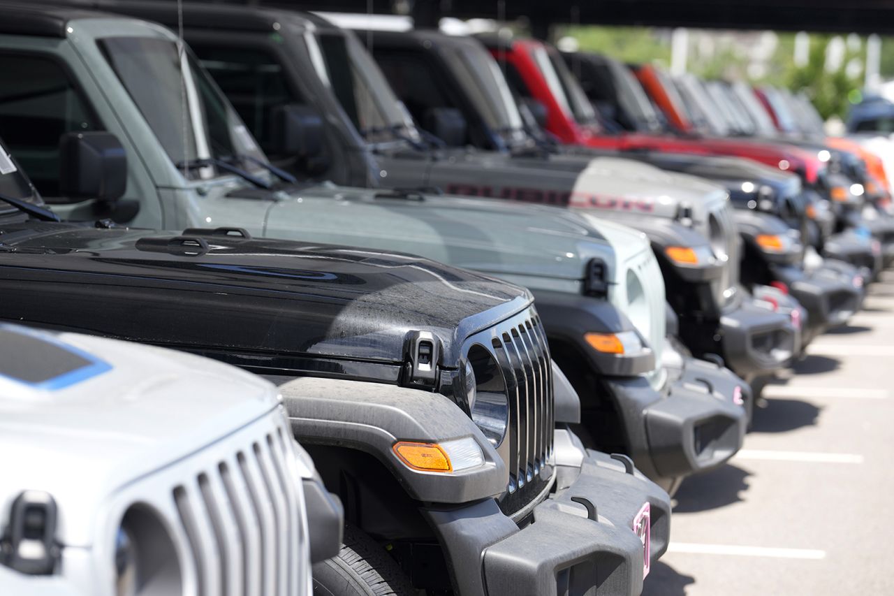 Unsold 2023 Wrangler sports-utility vehicles sit in a long row at a Jeep dealership on June 18 in Englewood, Colorado. 