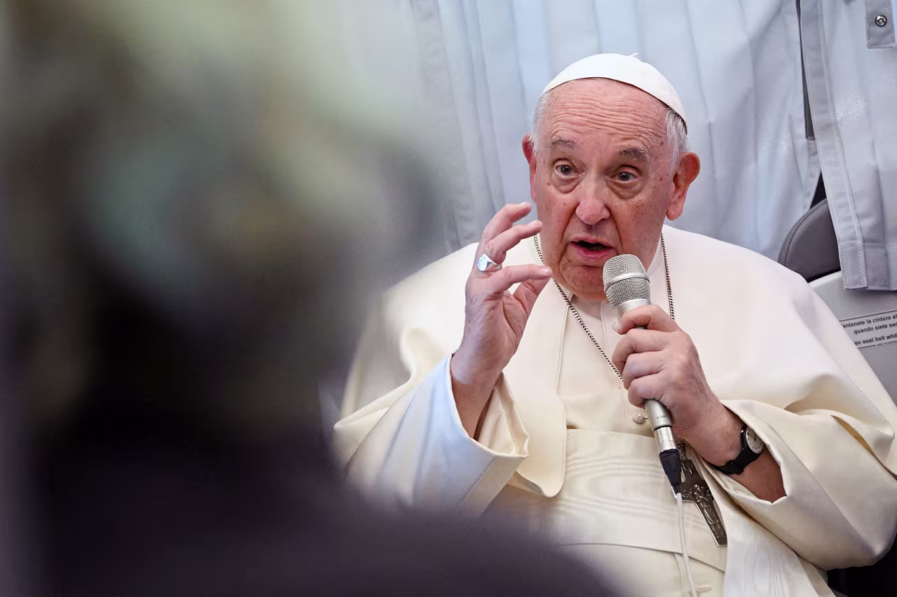 Pope Francis holds a news conference aboard a plane as he returns to the Vatican following his journey to Hungary on April 30. 