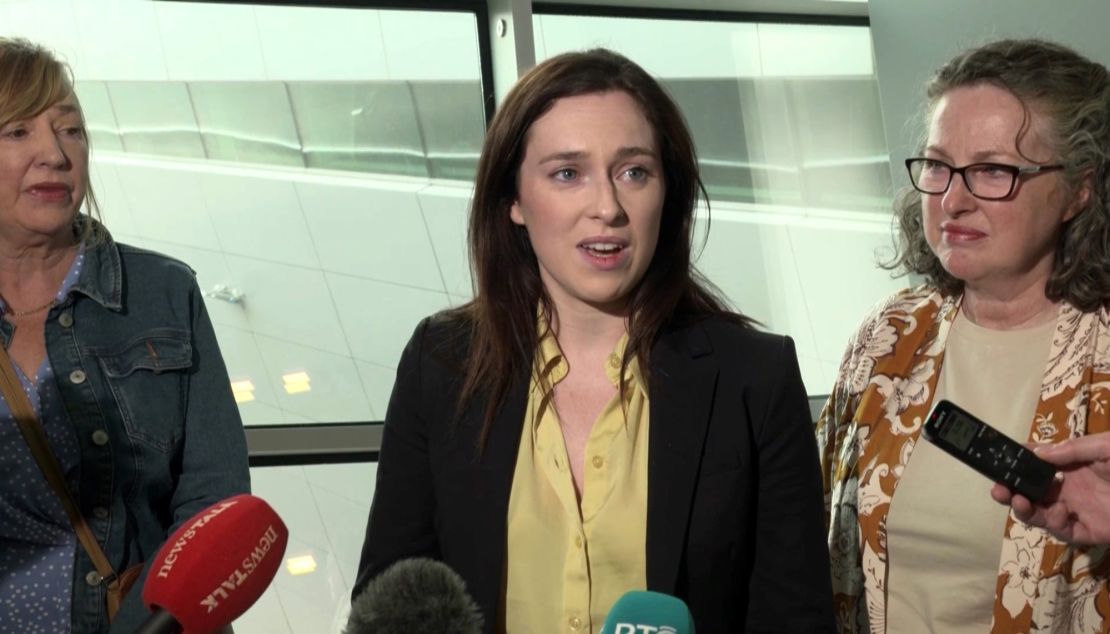 Tori Towey speaking to media after arriving home to Dublin Airport with her aunt, Ann Flynn (left) and her mother Caroline (right) on July 11, 2024.