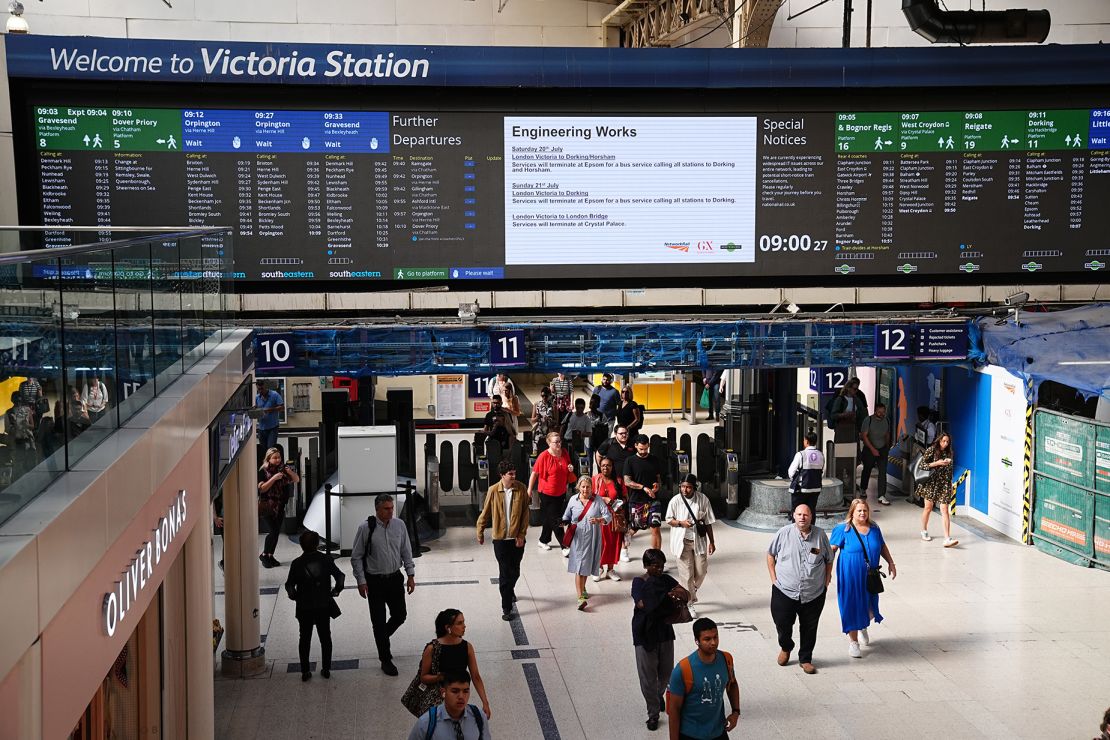 In the UK, National Rail reported “widespread IT issues across the entire network” on Friday. Pictured here: travelers at London's Victoria train station, London on Friday.