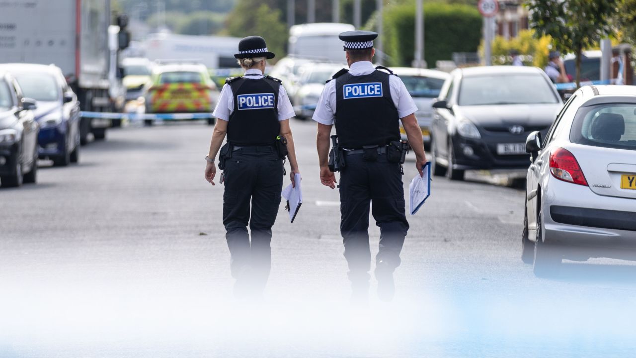 Police officers near the scene in Hart Street, Southport, where two children died and nine were injured in a "ferocious" knife attack during a Taylor Swift event at a dance school on Monday. A 17-year-old male from Banks, Lancashire, has been arrested on suspicion of murder and attempted murder over the incident. Picture date: Tuesday July 30, 2024. PA Photo. See PA story POLICE Southport. Photo credit should read: James Speakman/PA Wire