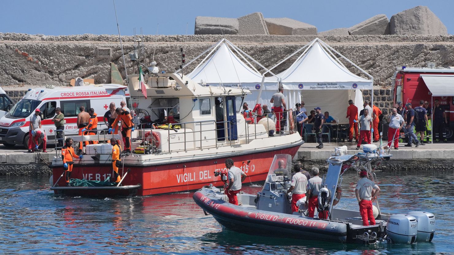 A body bag is brought ashore at Porticello harbor, Sicily, August 23, 2024.