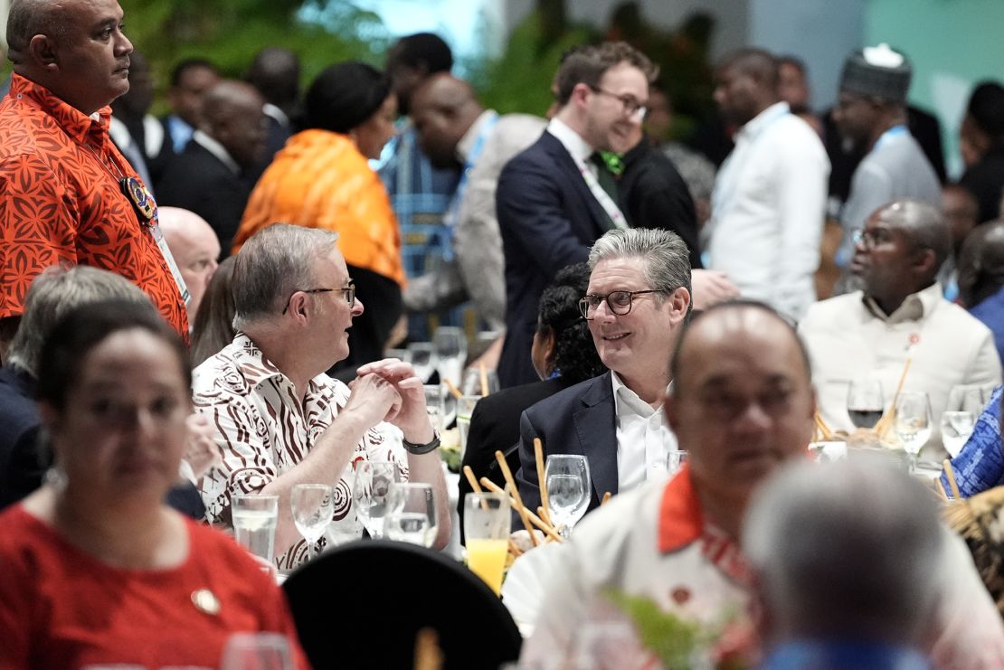 Britain's Prime Minister Keir Starmer speaks with his Australian counterpart, Anthony Albanese, at a state banquet opening the summit on Thursday.