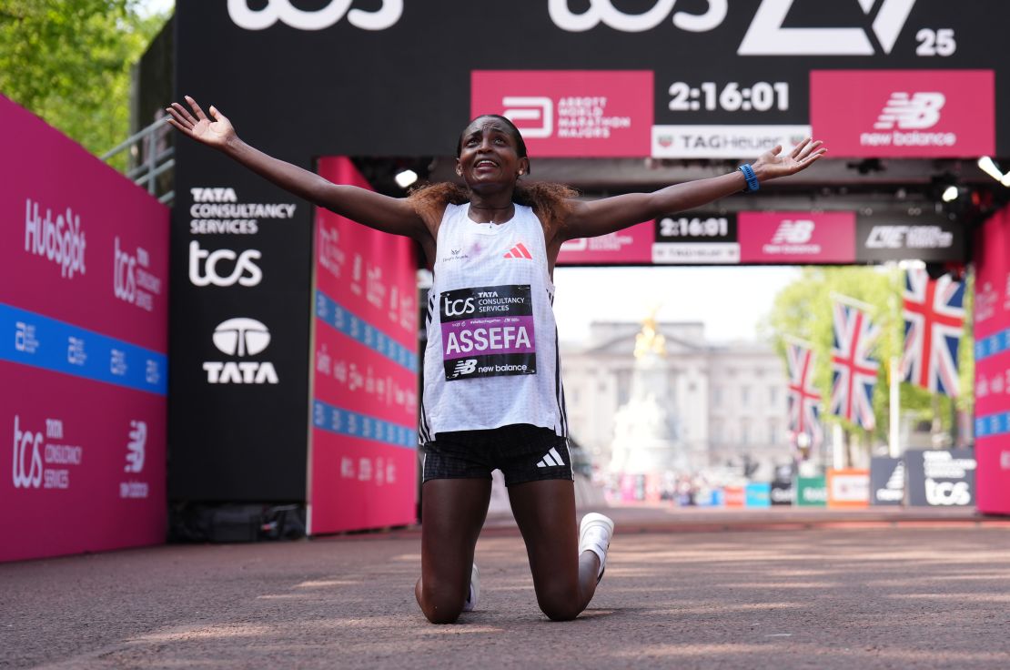 Tigst Assefa celebrates winning the women's elite race at the London Marathon.