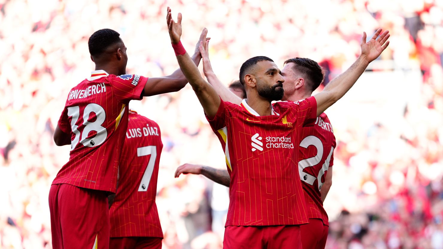 Liverpool's Mohamed Salah celebrates scoring the fourth goal of the game with teammates Sunday.