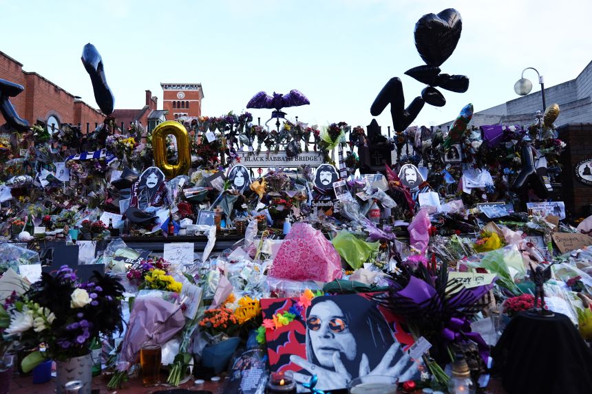 Floral tributes left at the Black Sabbath Bridge bench on Broad Street in Birmingham in memory of Black Sabbath frontman Ozzy Osbourne.