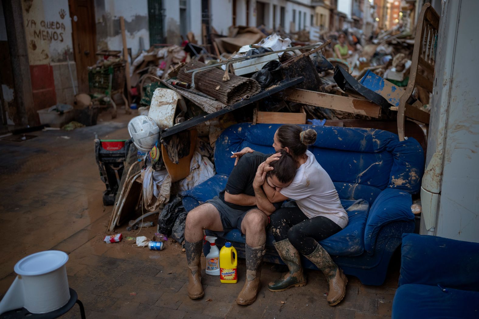 A woman hugs her brother-in-law after rescuing some of their belongings from their flooded house in Paiporta, Spain, on Tuesday, November 5. <a href="index.php?page=&url=https%3A%2F%2Fwww.cnn.com%2F2024%2F10%2F31%2Fworld%2Fgallery%2Fflash-flooding-spain%2Findex.html">Deadly flash floods</a> ripped across southern and eastern Spain. Some areas received up to 12 inches of rain in just a few hours.