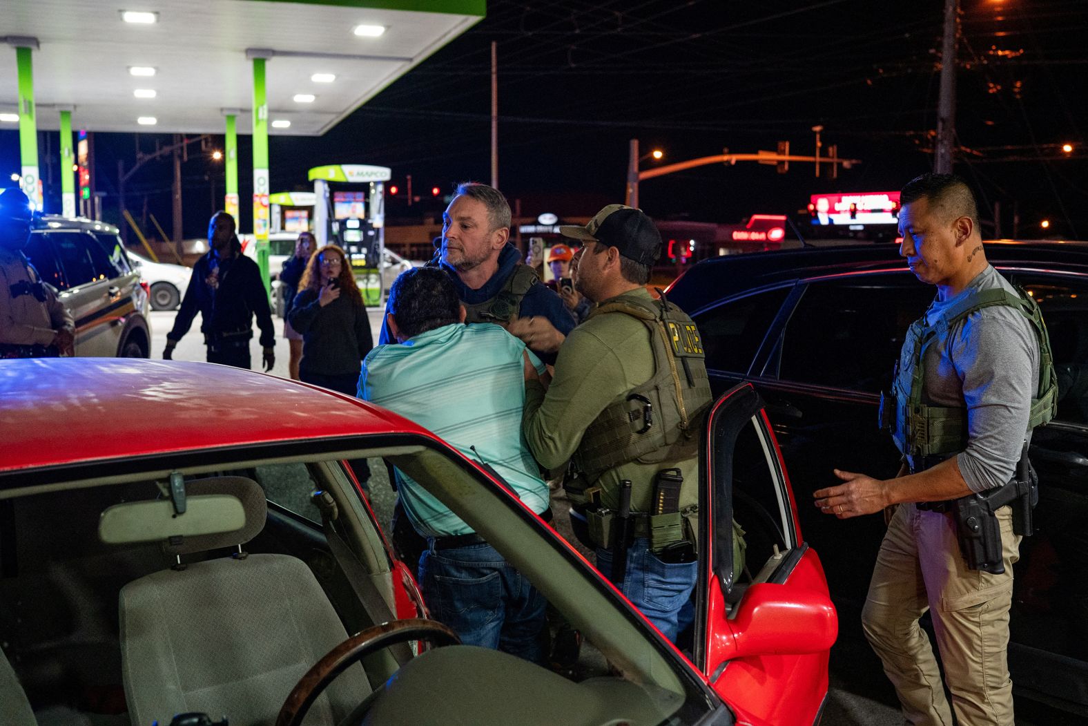 Federal immigration officials detain a man at a gas station in Nashville, Tennessee, on Saturday, May 10. <a href="index.php?page=&url=https%3A%2F%2Fwww.cnn.com%2F2025%2F05%2F10%2Fus%2Farrest-tennessee-trumps-deportation">More than 100 people were taken into custody by immigration officials</a> in a joint operation with the Tennessee Highway Patrol.