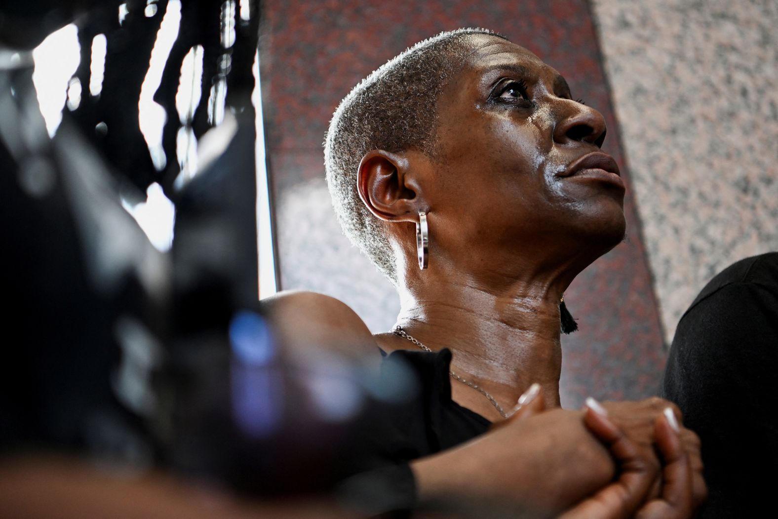 Zsa Zsa Floyd, George Floyd's eldest sister, sheds a tear during a memorial service in Pearland, Texas, marking <a href="index.php?page=&url=https%3A%2F%2Fwww.cnn.com%2F2025%2F05%2F25%2Fus%2Floved-ones-george-floyd-legacy">the fifth anniversary of his death</a> on Sunday, May 25. Floyd’s death sparked massive protests across the nation over police brutality. The four former police officers involved in his death were later convicted on both state and federal crimes.