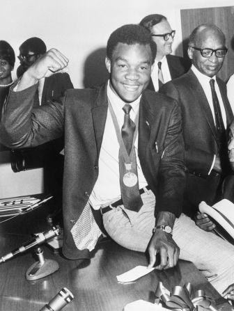 Foreman wears his Olympic gold medal while visiting the Job Corps headquarters in Washington, DC, in 1968.