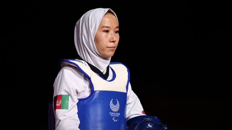 Tokyo 2020 Paralympic Games - Taekwondo - Women K44 -49kg Repechage Quarterfinal - Makuhari Messe Hall B, Chiba, Japan - September 2, 2021. Zakia Khudadadi of Afghanistan makes her entrance for her bout against Viktoriia Marchuk of Ukraine REUTERS/Thomas Peter