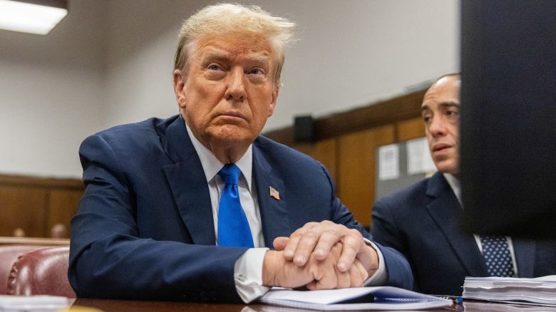Former US President Donald Trump sits in the courtroom at Manhattan criminal court in New York, US, on Thursday, April 18, 2024. Former US President Donald Trump faces 34 felony counts of falsifying business records as part of an alleged scheme to silence claims of extramarital sexual encounters during his 2016 presidential campaign.    JEENAH MOON/Pool via REUTERS