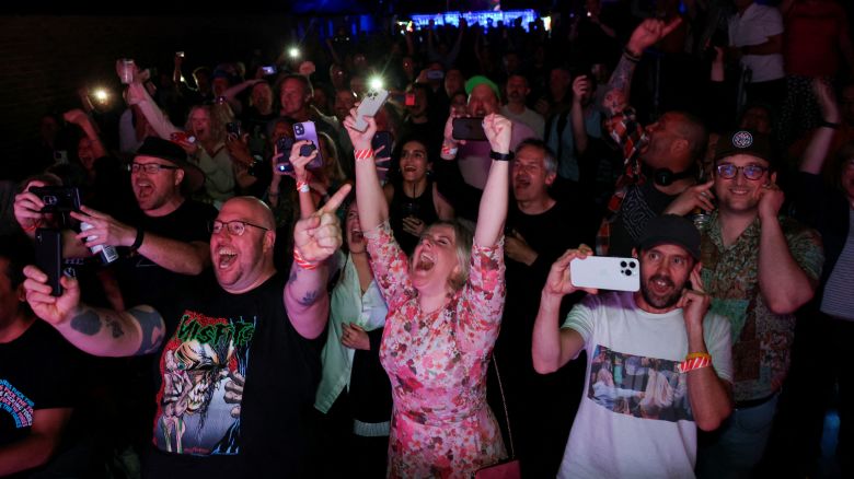 Party-goers celebrate early election results at a "Stop The Tories" election afterparty in London, on July 4.