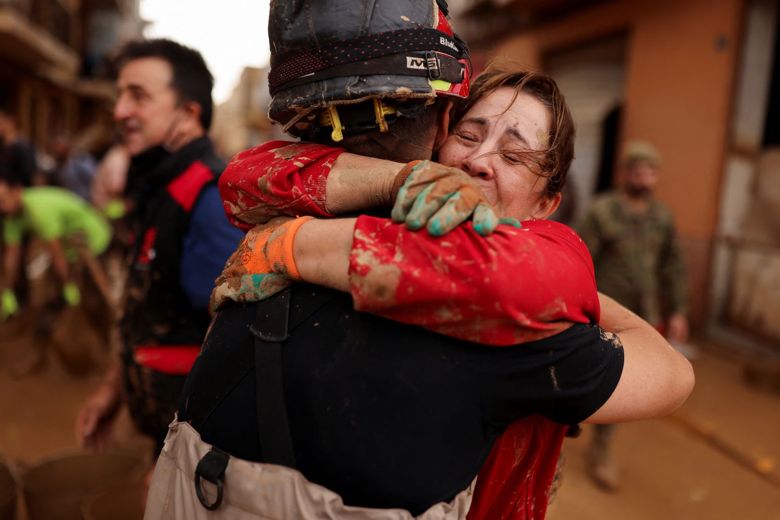 A woman embraces a member of the Emergency Military Unit in Sedavi on Sunday.