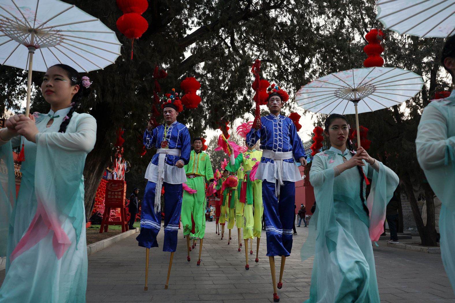Folk artists perform at a temple fair, on the first day of the Lunar New Year in Beijing, China, on Wednesday.