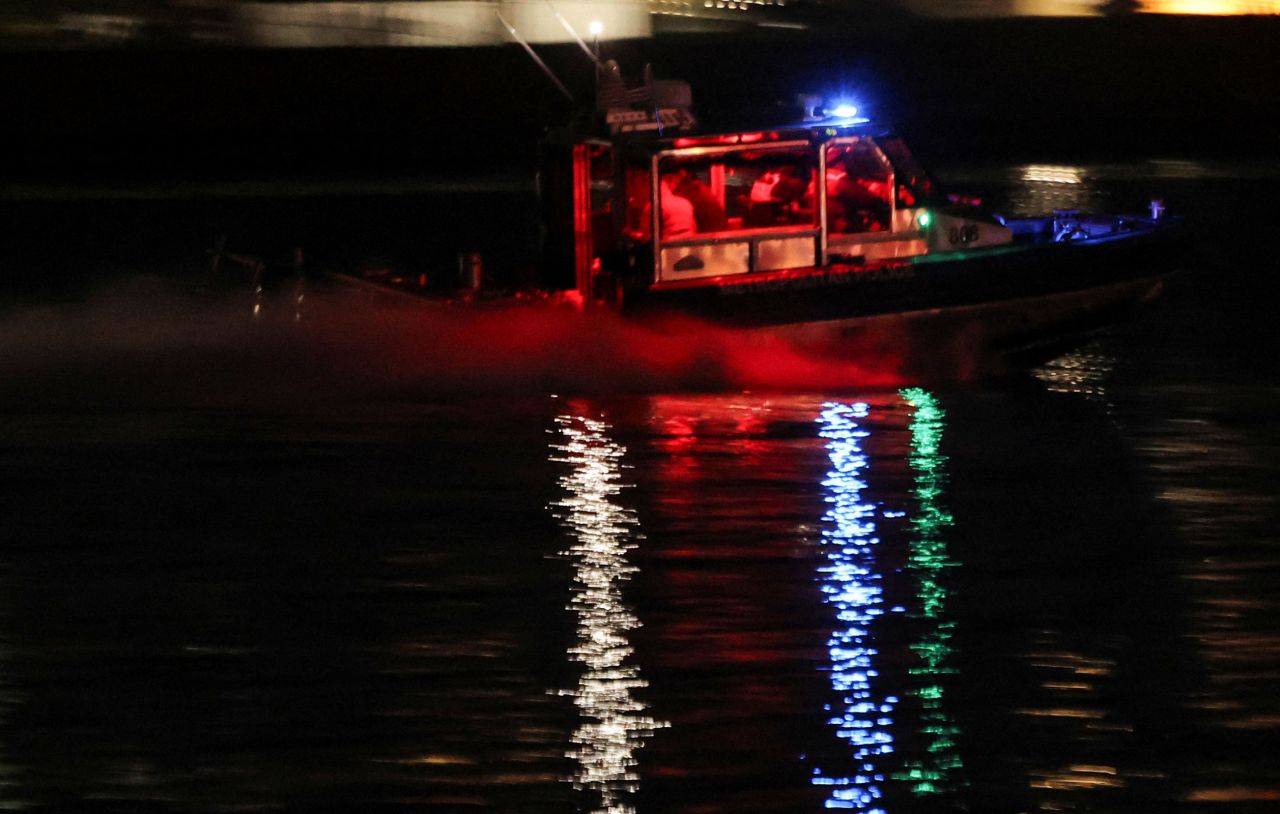 A search and rescue boat operates along the Potomac River.