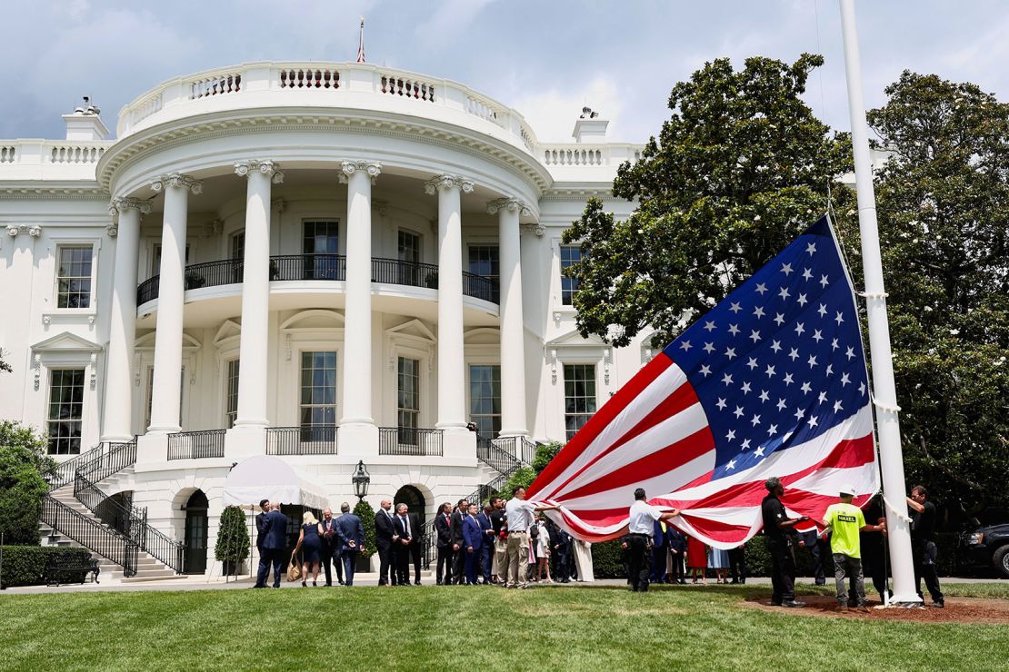 A US flag is prepared to be raised on a new flagpole on the South Lawn of the White House on June 18, 2025.