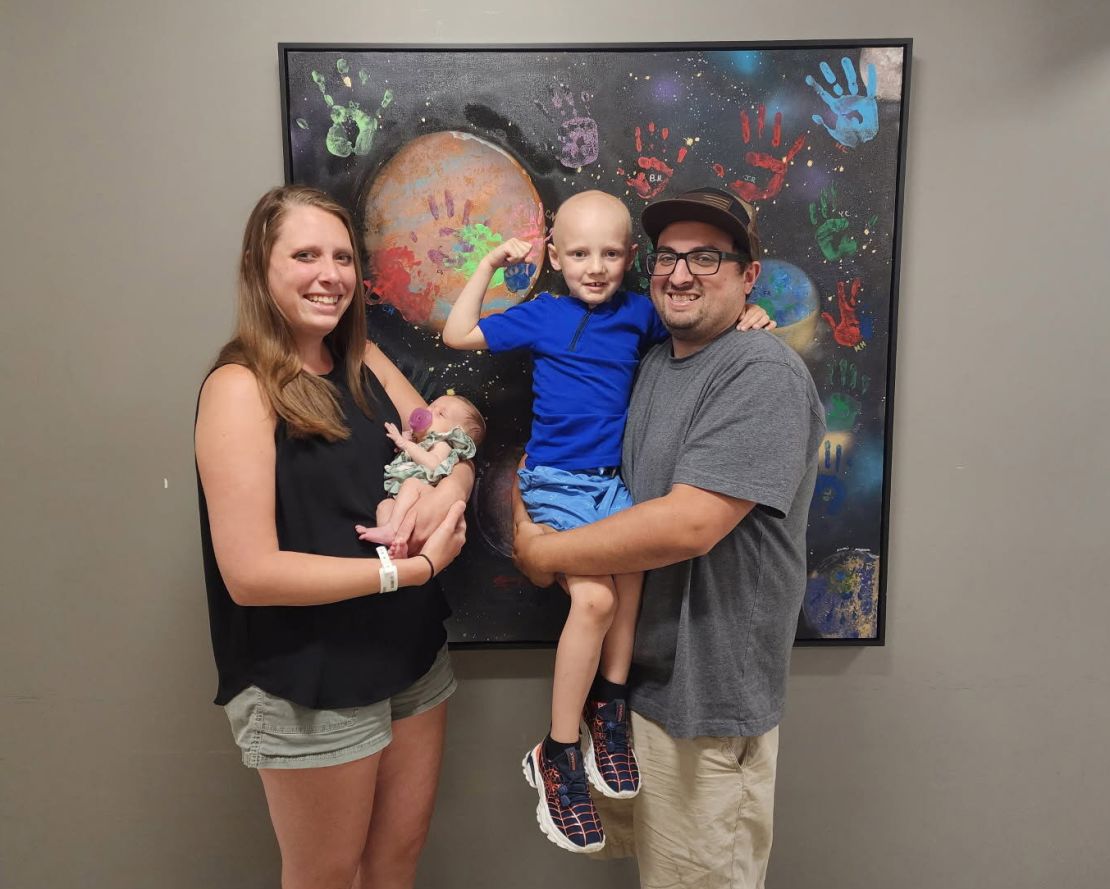 Cailen with his dad Cody, and mom Aly holding his newborn baby sister Alyssa. The whole family was with Cailen for his initial treatments, but now Alyssa has to stay with grandparents while Cody and Aly sleep in Cailen's hospital room.