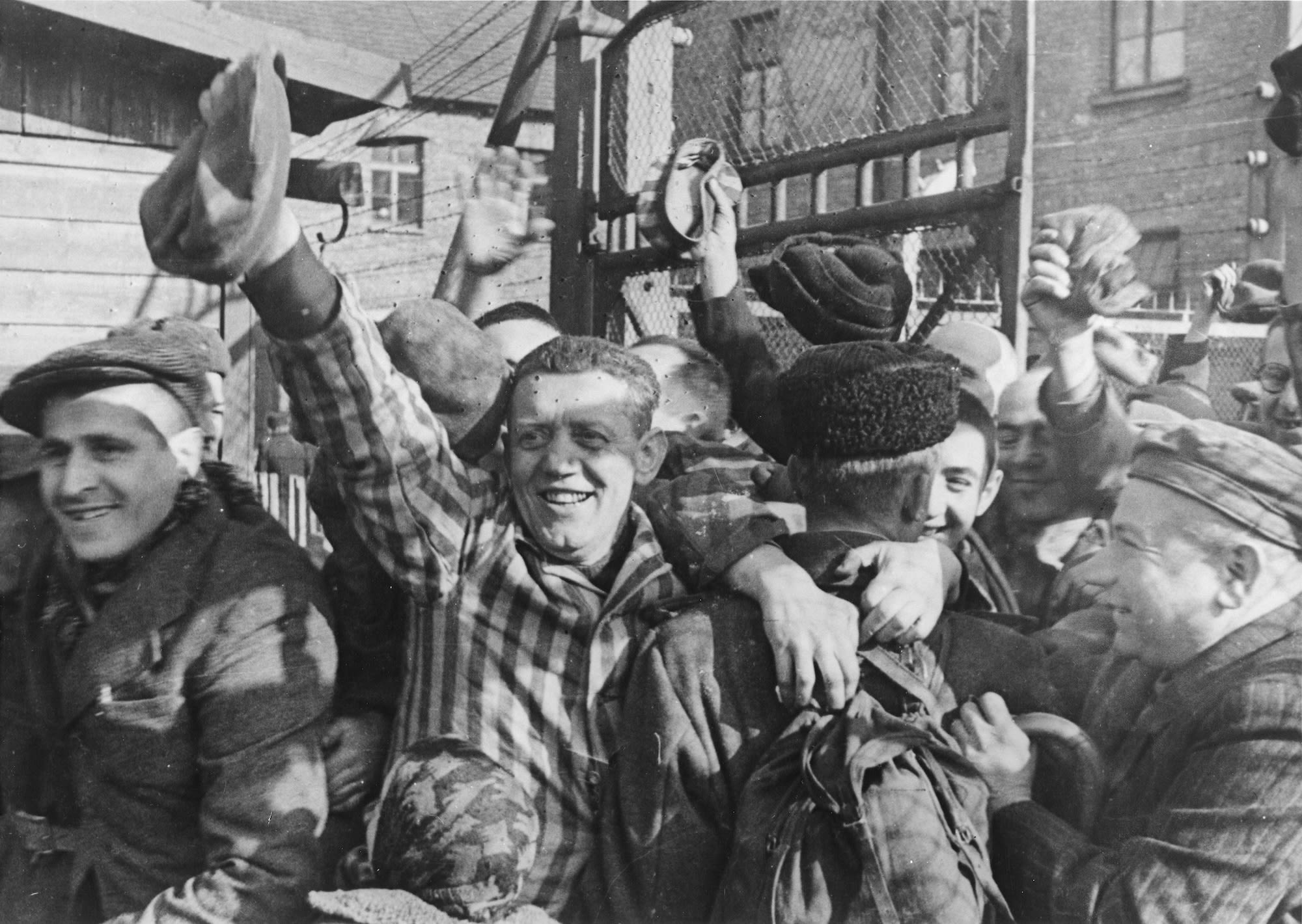 Prisoners of Auschwitz greet their liberators in 1945.