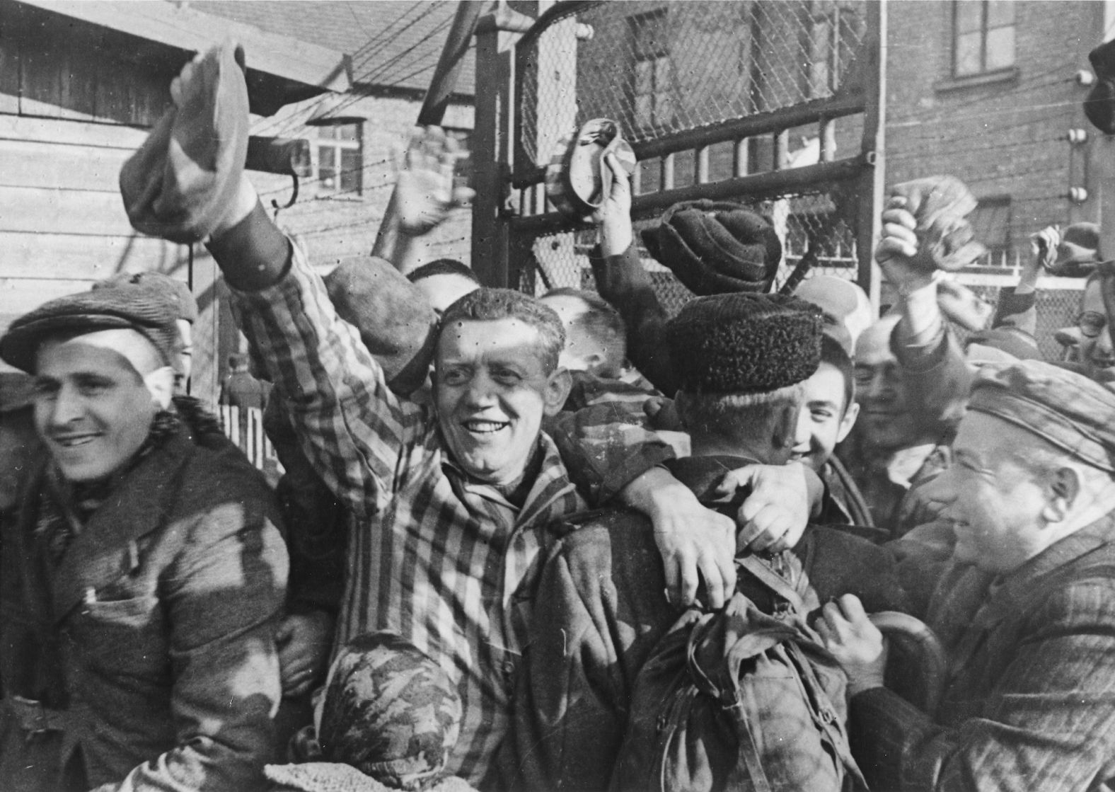 Prisoners of Auschwitz greet their liberators in 1945.