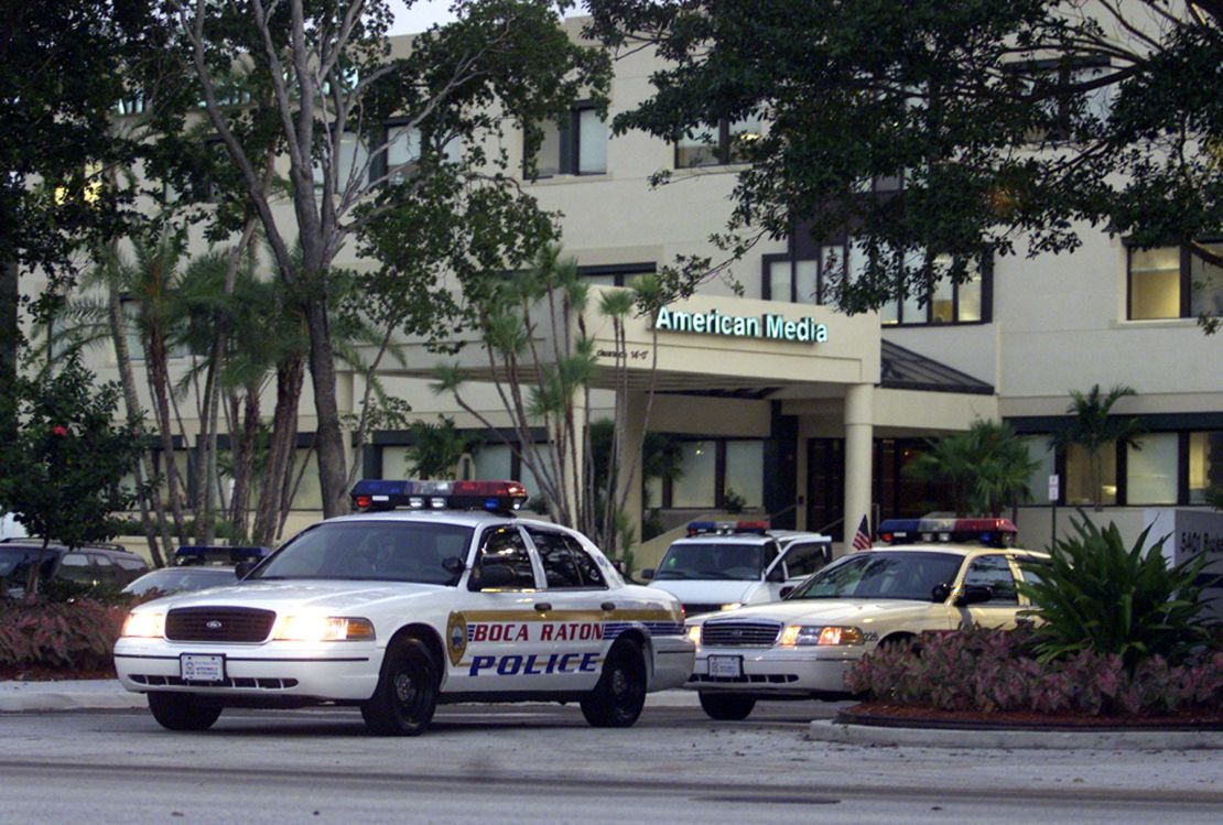 Police cars are parked outside the American Media building in Boca Raton on  Oct. 8, 2001 where environmental tests detected anthrax bacteria.