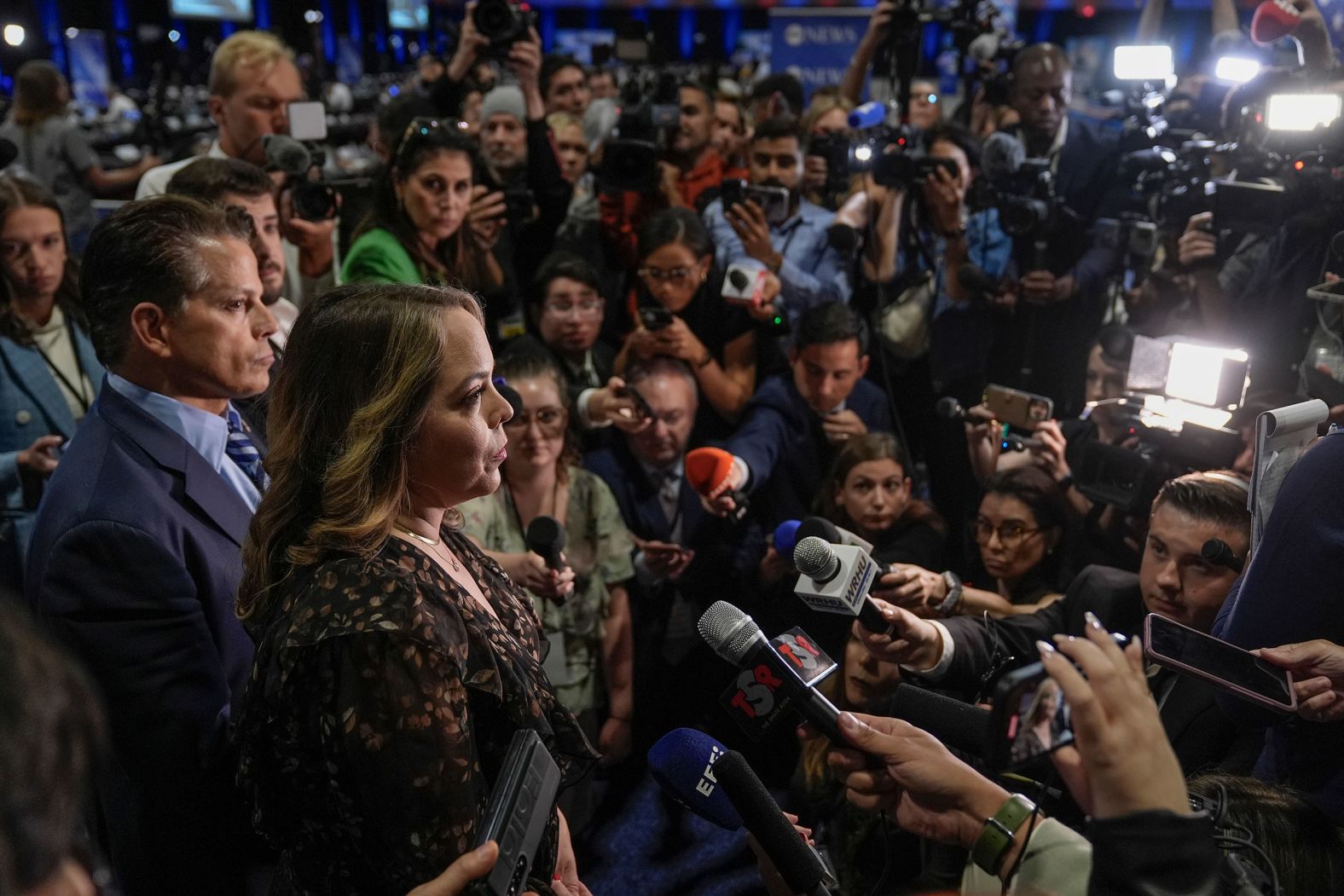 Former Trump officials Anthony Scaramucci and Olivia Troye, who both support Harris, talk to reporters in the spin room before the debate.