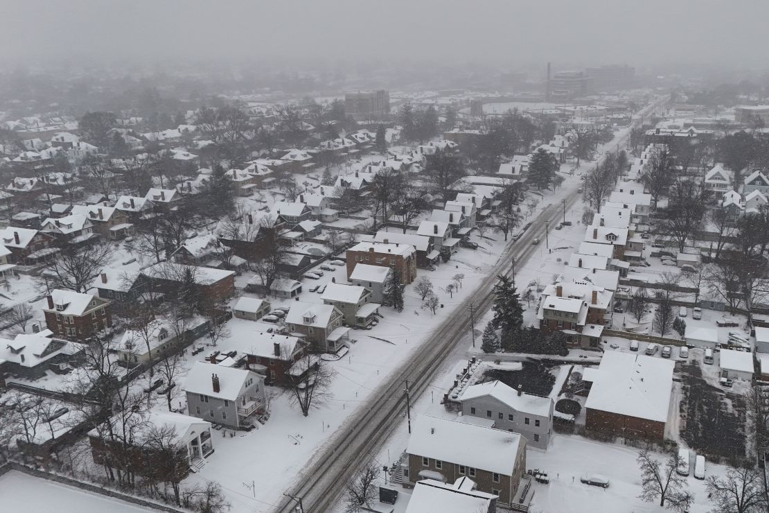 Snow covers homes during a winter storm, Monday, Jan. 6, 2025, in Cincinnati.