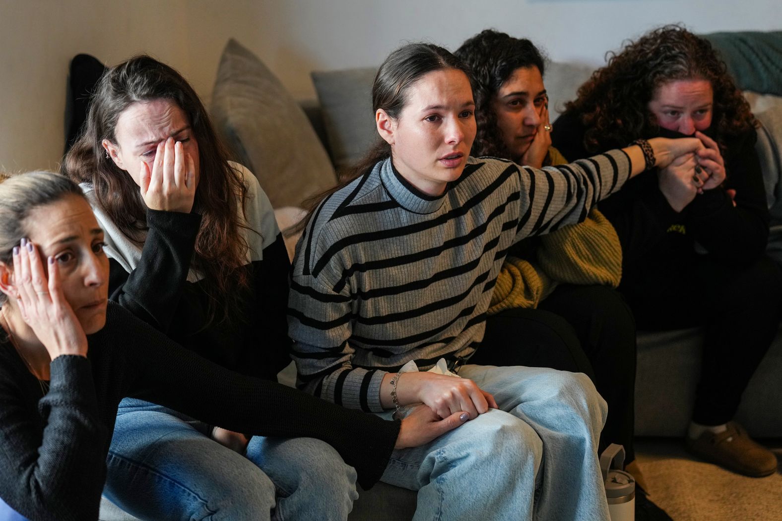 Friends of Arbel Yehoud, a 29-year-old German-Israeli hostage, react as they watch a broadcast of her being released by Palestinian militants on Thursday, January 30. Yehoud was among eight hostages released in Gaza on Thursday. <a href="index.php?page=&url=https%3A%2F%2Fwww.cnn.com%2F2025%2F01%2F30%2Fmiddleeast%2Fisrael-gaza-hostage-release-chaos-intl-latam%2Findex.html">The chaotic scenes surrounding the release of seven of those hostages</a> brought condemnation from Israeli leaders and a temporary delay in the release of Palestinian prisoners, who were ultimately freed later in the day as part of a ceasefire deal between Hamas and Israel.