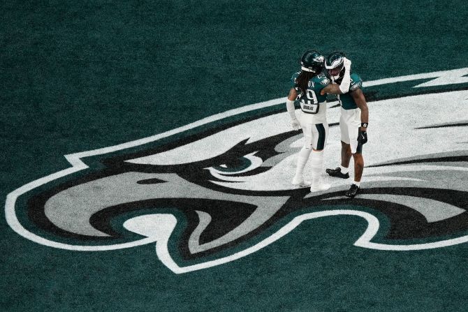 Eagles defensive backs Avonte Maddox, left, and C.J. Gardner-Johnson embrace before the game.