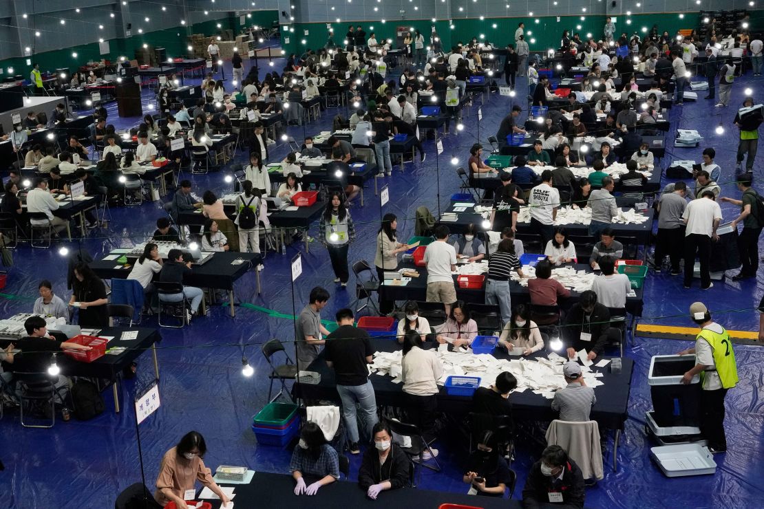 National Election Commission officials sort out ballots for counting in Seoul, South Korea, after Tuesday's snap presidential election.