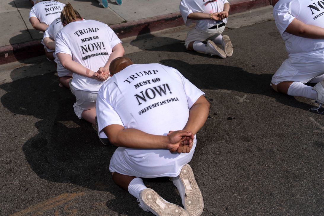 People take part in a human art installation depicting immigrants in detention outside the federal building in Los Angeles on July 17.
