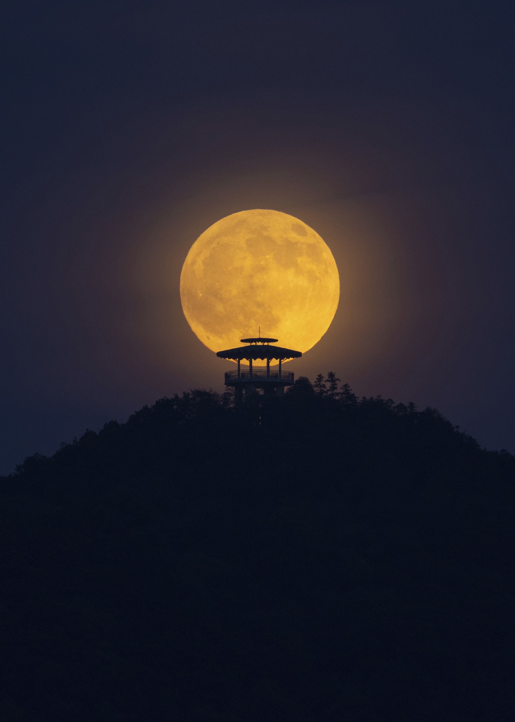 The total lunar eclipse is seen over the night sky in Jiujiang, China, on Sunday, September 7.