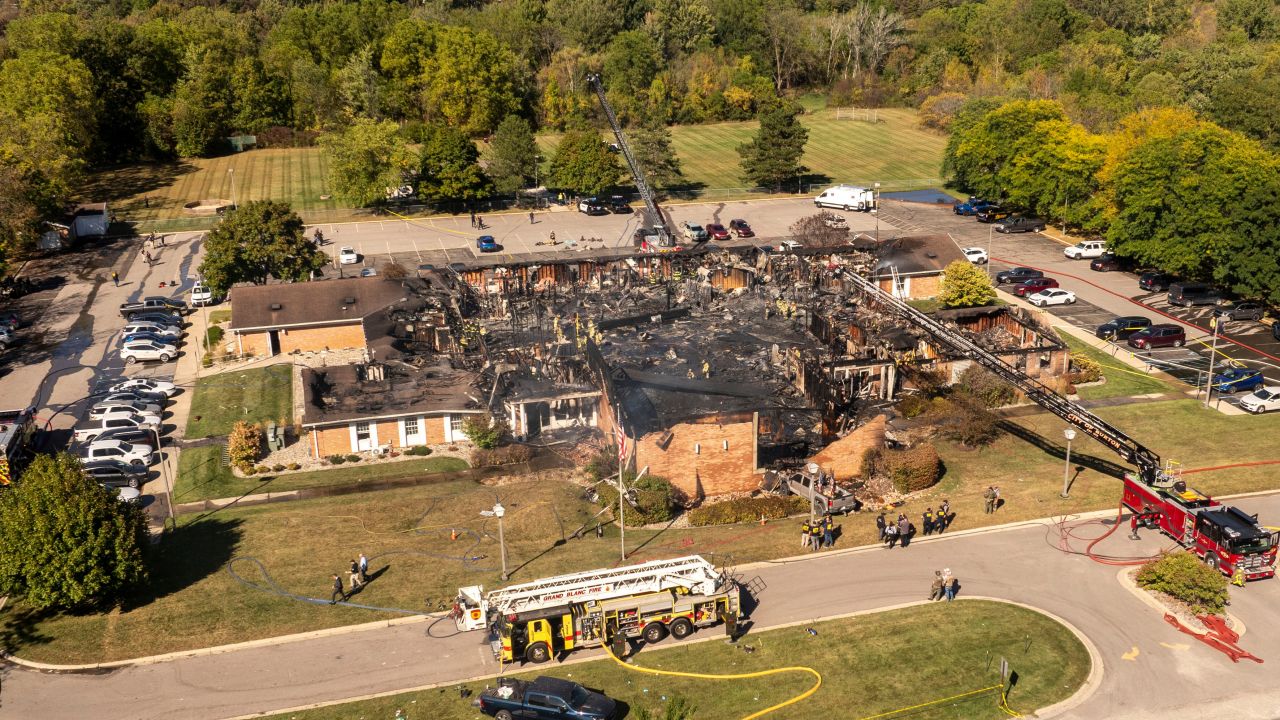 Emergency crews respond to a shooting and fire at The Church of Jesus Christ of Latter-day Saints, in Grand Blanc, Mich., Sunday, Sept. 28, 2025. (David Guralnick/Detroit News via AP)