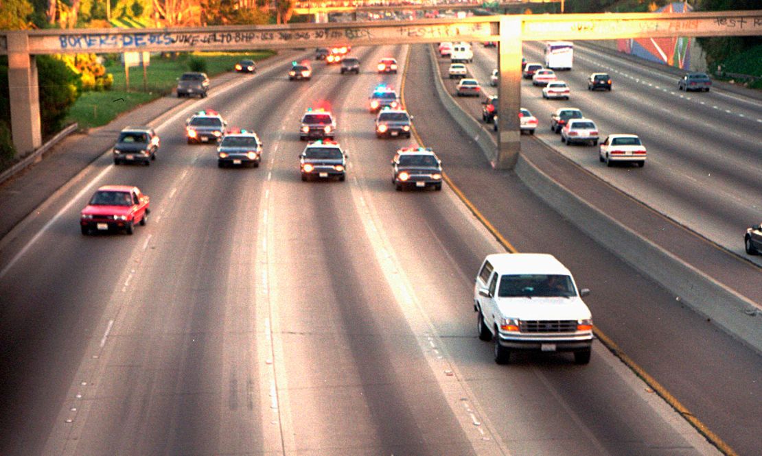 In this June 17, 1994, file photo, a white Ford Bronco, driven by Al Cowlings carrying O.J. Simpson, is trailed by Los Angeles police cars as it travels on a freeway in Los Angeles.