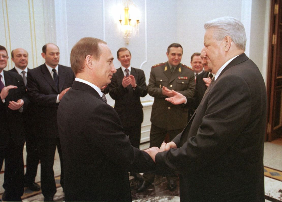 Then-Prime Minister Vladimir Putin shakes hands with President Boris Yeltsin in the Kremlin, Moscow, on December 31, 1999.