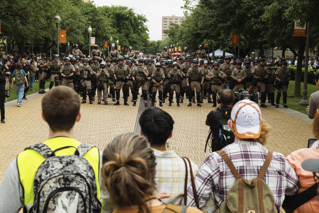 Pro-Palestinian demonstrators face off Wednesday with state officers at the University of Texas at Austin.