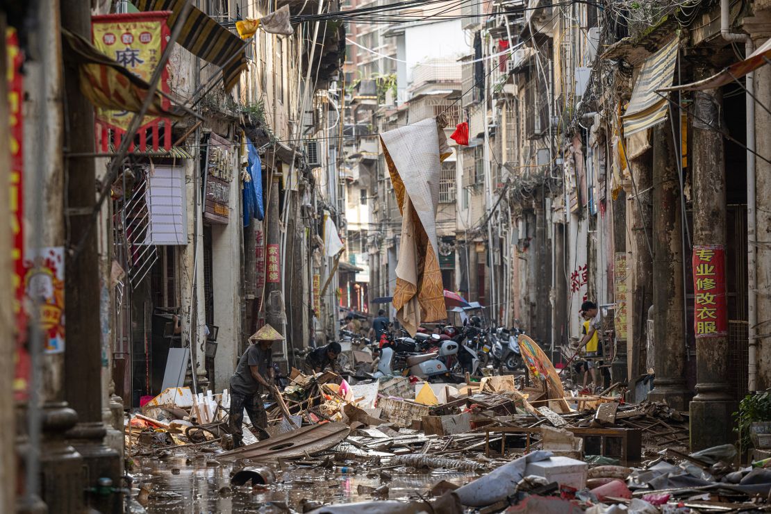 Villagers clean rubbish after torrential rains caused flooding in Meizhou, Guangdong province of China on June 19.