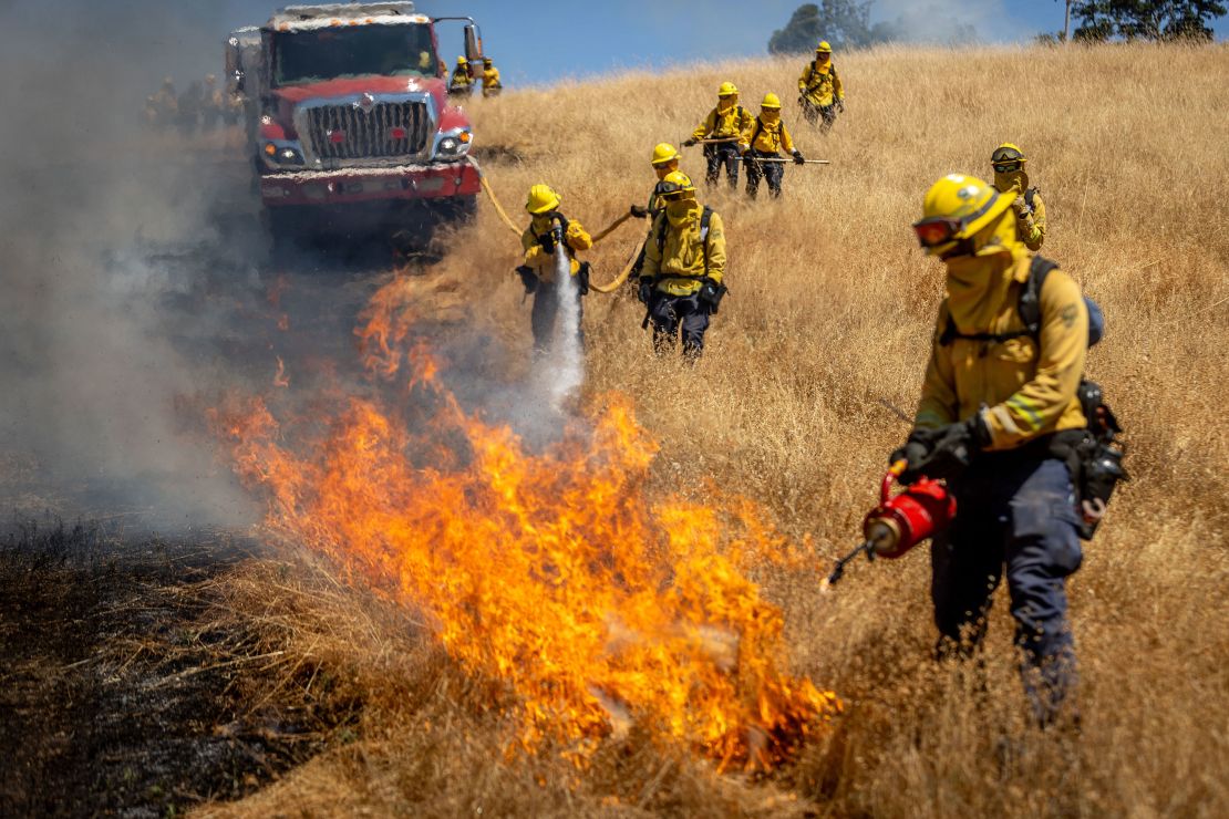 Marin County firefighters use a drip torch during a controlled burn exercise June 21 in San Rafael, California.