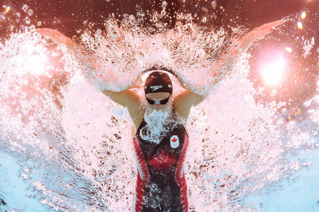 An underwater view shows Canada’s Summer McIntosh competing in the heats of women's 400m individual medley swimming event during the Paris 2024 Olympic Games at the Paris La Defense Arena in Nanterre, west of Paris, on July 29, 2024. (Photo by Manan VATSYAYANA / AFP)