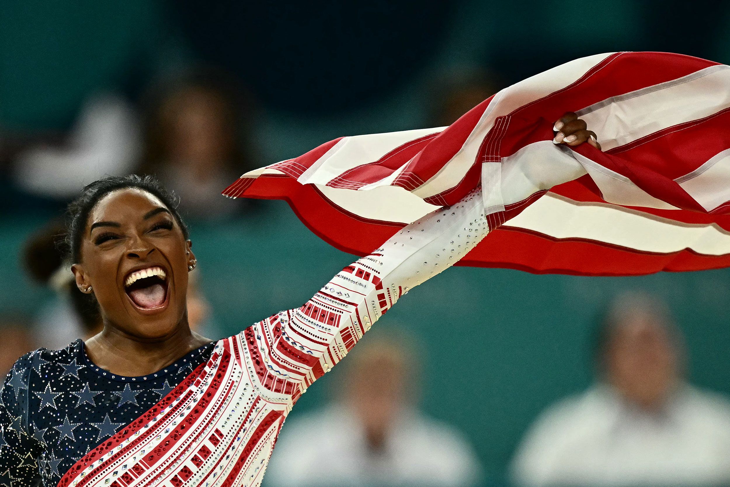 Biles waves the American flag after winning gold. Team USA won gold at the 2012 and 2016 Olympics but finished with the silver three years ago in Tokyo.