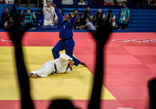 France's <a >Teddy Riner</a> reacts after beating South Korea's Kim Min-jong in a judo final on August 2. Riner, who lit the Olympic flame to conclude the opening ceremony, won his fourth gold medal, the most by a judoka in Olympic history.