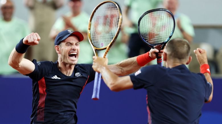 Andy Murray of Team Great Britain celebrates with partner Dan Evans of Team Great Britain after winning match point against Sander Gille of Team Belgium and Joran Vliegen of Team Belgium during the Men's Doubles second round match on day four of the Olympic Games Paris 2024 at Roland Garros on July 30, 2024 in Paris, France.