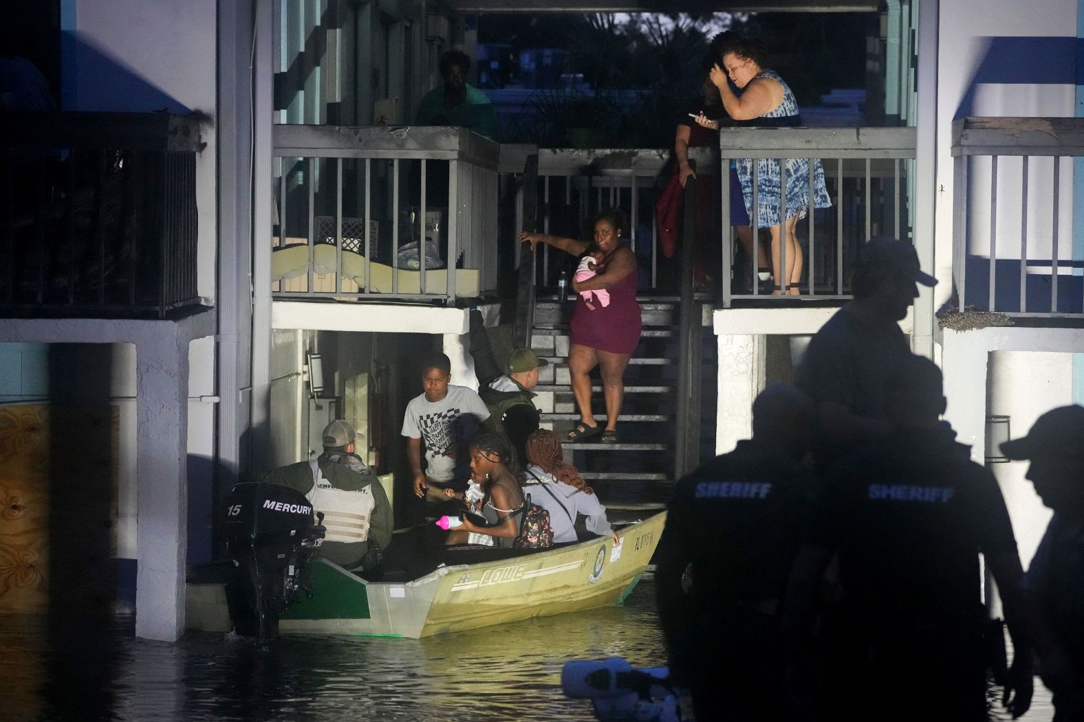 People are rescued from an apartment complex in Clearwater on Thursday.